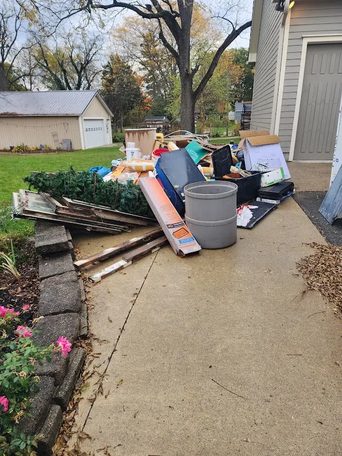 Dumpster being loaded with debris for 30 Yard Dumpster Rental in Olyphant